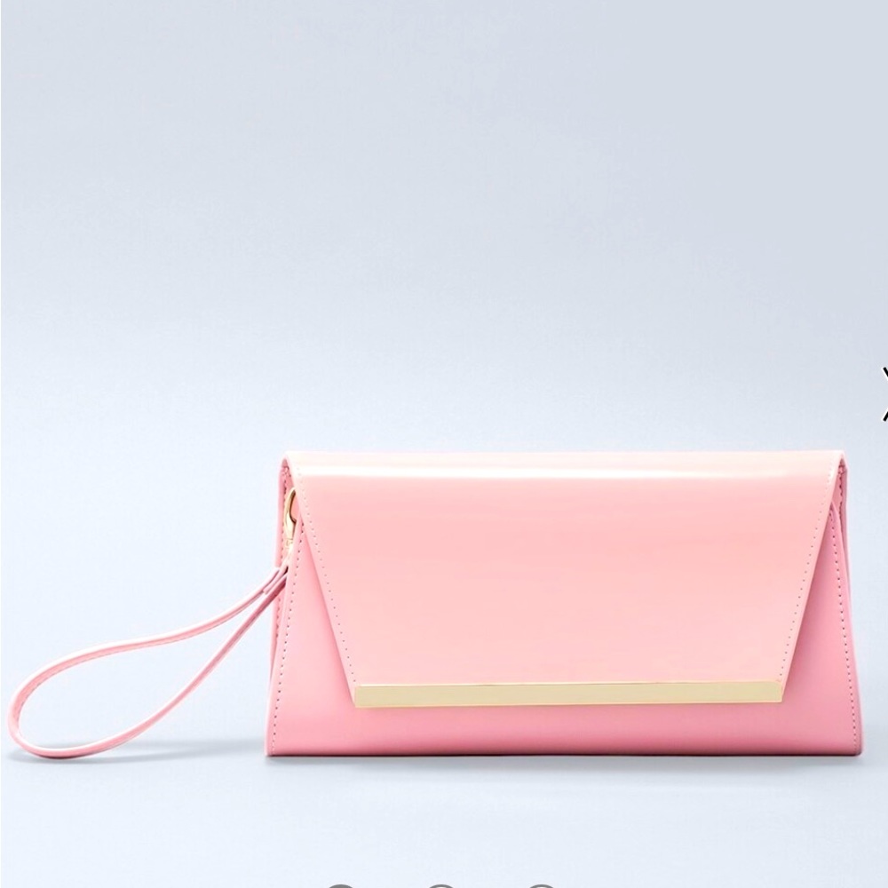 Patent Clutch in antique bloom with a 
removable chain strap and wristlet strap.